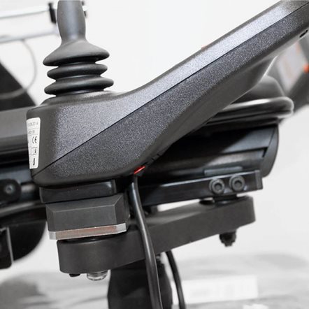 Close up of a power wheelchair controller mounted on a movein-moveout fixation.