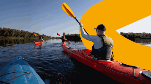 One person kayaking on a river  