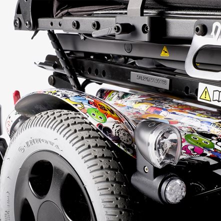 Close up of a comic-book style foil-wrapped shroud on a power wheelchair.