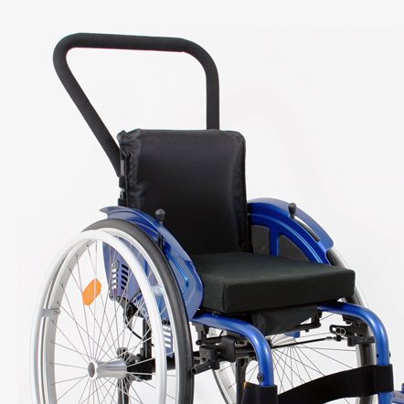 A paediatric manual wheelchair with a mounted continuous push handle.