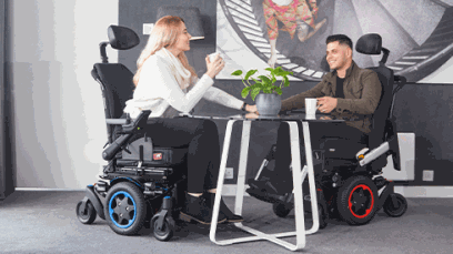 People in a mid wheel drive powered wheelchair.