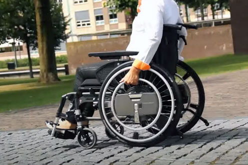 WheelDrive power assist for wheelchairs. Go further.