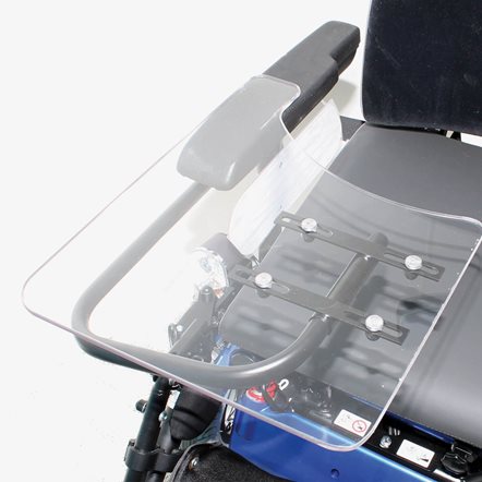 Close-up of a transparent tray table on a powered wheelchair.